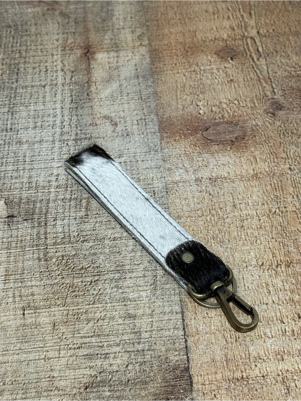 keychain hair-on-hide cowhide strap paired with a brass hook